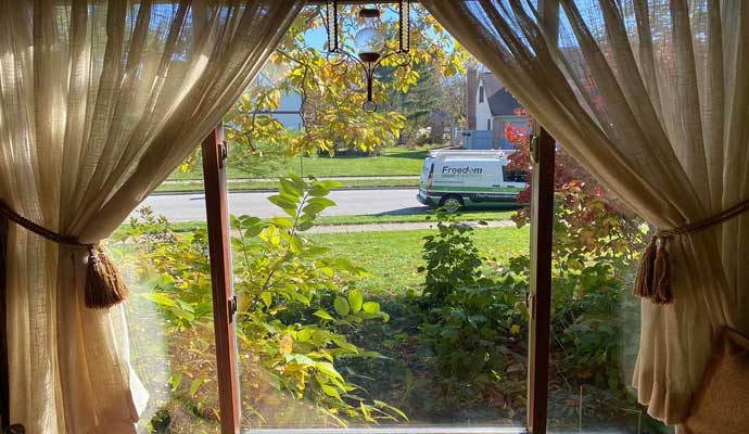 An installed brown awning window