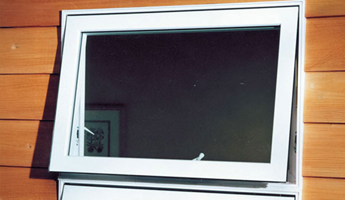 An installed awning window on the wall